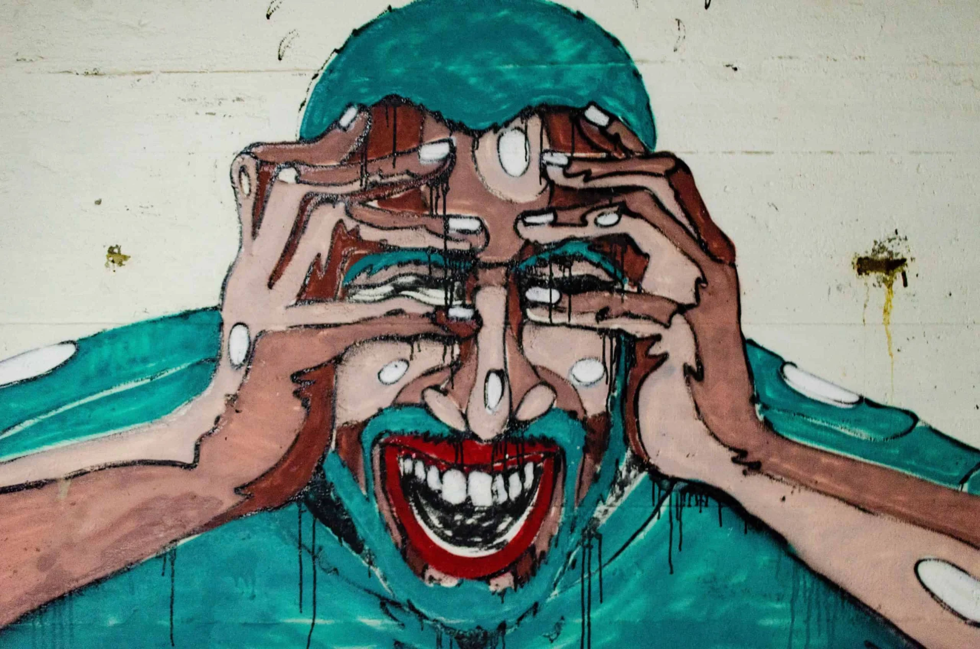 A painting of a man covering his face with his hands.